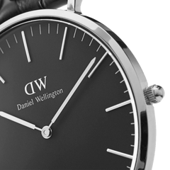 Detail view of the Classic Cornwall Black Silver watch highlighting the polished silver case, minimalist black dial, and slim silver hands and hour markers.