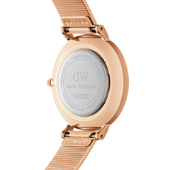 Rear view of the Petite Lumine Pressed Piano White MoP Rose Gold watch showing the engraved stainless steel case back and rose gold pressed piano link strap.