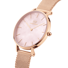 Close-up of the Petite Melrose Pearl featuring a rose gold mesh strap and a pink mother of pearl dial, highlighting its refined minimalist design and elegant finish.