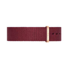 Ruby red NATO style watch strap made from durable polyester, featuring a slim profile and a rose gold buckle for a modern, elegant finish.