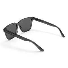 Rectangular Bio-Acetate Grey Grey sunglasses with a transparent grey oversized frame, grey UV400 lenses, and Daniel Wellington branding visible on the temple and inner arm.