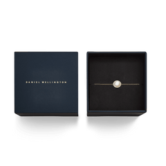 Audrey Bracelet Mother of Pearl Gold presented in a premium navy gift box, featuring a domed mother of pearl centrepiece surrounded by white cubic zirconia on a slim gold chain.
