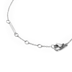 Detail of the Audrey Bracelet Tiger Eye Silver showing the adjustable silver chain with multiple sizing rings, a secure lobster clasp, and a branded tag for a comfortable, personalised fit.