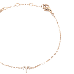 Close-up of the Crystal Zodiac Chain Bracelet Rose Gold, highlighting the slim rose gold chain, adjustable sizing rings, and a sparkling crystal zodiac pendant.