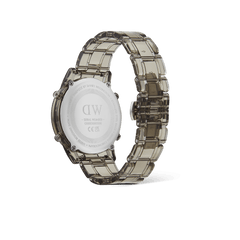 Retro Digital Light Grey Light Grey watch showing the back of the round case, engraved with branding and serial number, and a transparent light grey link strap with butterfly buckle.