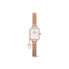Rose gold ladies watch with a rectangular crystal-framed case, white mother of pearl dial, and an interchangeable crystal zodiac charm on an adjustable mesh strap.