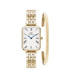 Rectangular gold watch with a five-link strap, white dial featuring roman numerals and blue hands, paired with a slim gold bracelet engraved with the Daniel Wellington name.