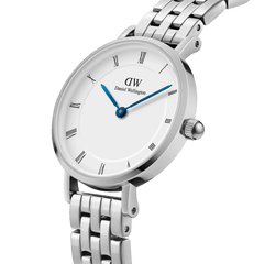 Petite Roman Numerals 5-Link Silver watch with a white dial, Roman numerals, blue steel hands, and a polished five-link stainless steel bracelet, shown in a close-up angle highlighting its minimalist design and refined finish.