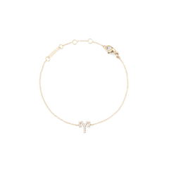 Delicate gold chain bracelet featuring an Aries zodiac charm set with sparkling crystals, adjustable with multiple sizing rings and finished with a secure lobster clasp.
