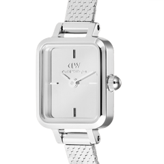 Close-up of the Quadro Mini Reflection Silver watch showing the mirror-effect silver dial, minimalist hour markers, and polished rectangular case with a fine mesh strap, highlighting its elegant and modern design.