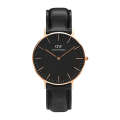 Classic Sheffield Black Rose Gold men’s watch with a black dial, slim rose gold case, minimalist markers, and a genuine black leather strap, shown against a plain background.