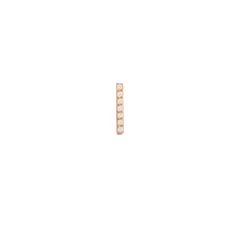 A slim gold bar stud earring set with seven sparkling cubic zirconia crystals, showcasing a minimalist and elegant design.