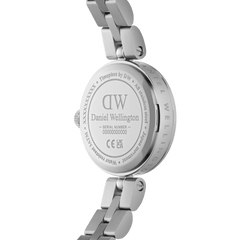 Close-up of the Elan Lumine Silver ladies watch showing the engraved stainless steel case back, serial number, and three-link bracelet detail.