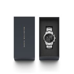 Iconic Chronograph Link Onyx S men's watch with a silver stainless steel bracelet and black dial, elegantly presented in a Daniel Wellington gift box.