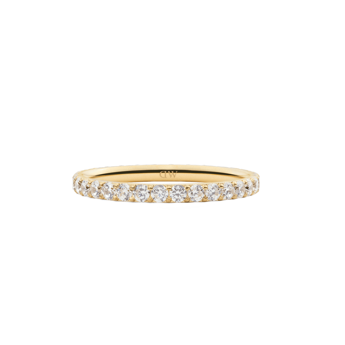 The Mirelle Eternity Ring Gold 2mm features a slim gold band set with a continuous row of sparkling white cubic zirconia crystals, offering a minimalist and elegant look ideal for stacking or wearing alone.
