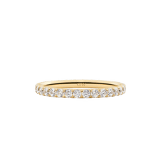 The Mirelle Eternity Ring Gold 2mm features a slim gold band set with a continuous row of sparkling white cubic zirconia crystals, offering a minimalist and elegant look ideal for stacking or wearing alone.