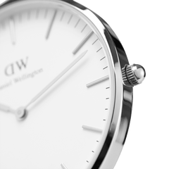 Detail view of the Classic Southampton Silver watch highlighting the polished silver case, textured crown, and minimalist eggshell white dial with slim silver markers and hands. The clean design showcases the watch’s refined craftsmanship and timeless appeal.