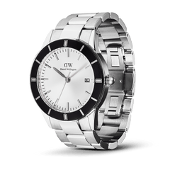Daniel Wellington Iconic Paradigma Link Black Bezel men's watch with a 40mm stainless steel case, striking black bezel, silver dial, and a three-link bracelet featuring both polished and brushed finishes.