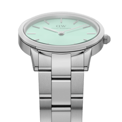 Side angle of the Iconic Link Mint Silver ladies watch, featuring a pastel mint green dial, minimalist markers, and a brushed stainless steel bracelet.
