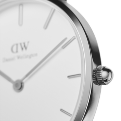 Detail of the Petite Sheffield Silver ladies watch, highlighting the polished stainless steel case, minimalist white dial, and slim crown for easy adjustment.