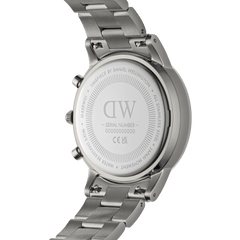 Back view of the Iconic Chronograph Link Graphite men's watch, showing the engraved stainless steel case, serial number, and robust link bracelet with adjustable clasp.