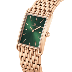 Bound 9-Link Emerald Sunray ladies watch with a rectangular rose gold case, integrated 9-link bracelet, and a vibrant green sunray dial, shown in a close-up angled view highlighting its geometric edges and minimalist markers.