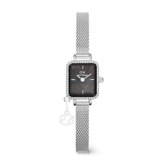 Quadro Mini Crystal Zodiac Sterling features a petite rectangular silver case with a crystal-framed bezel, a black mother of pearl dial, and an elegant mesh strap with an interchangeable zodiac charm.