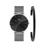 Classic Mesh Onyx watch with a black dial and stainless steel mesh strap, paired with a slim silver bracelet featuring Daniel Wellington branding, displayed side by side for a coordinated, modern look.