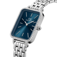 Quadro Lumine Bezel 5-Link Arctic Silver watch with a rectangular stainless steel case, vibrant blue dial, gemstone bezel, and a polished 5-link bracelet, highlighting its elegant and modern design.
