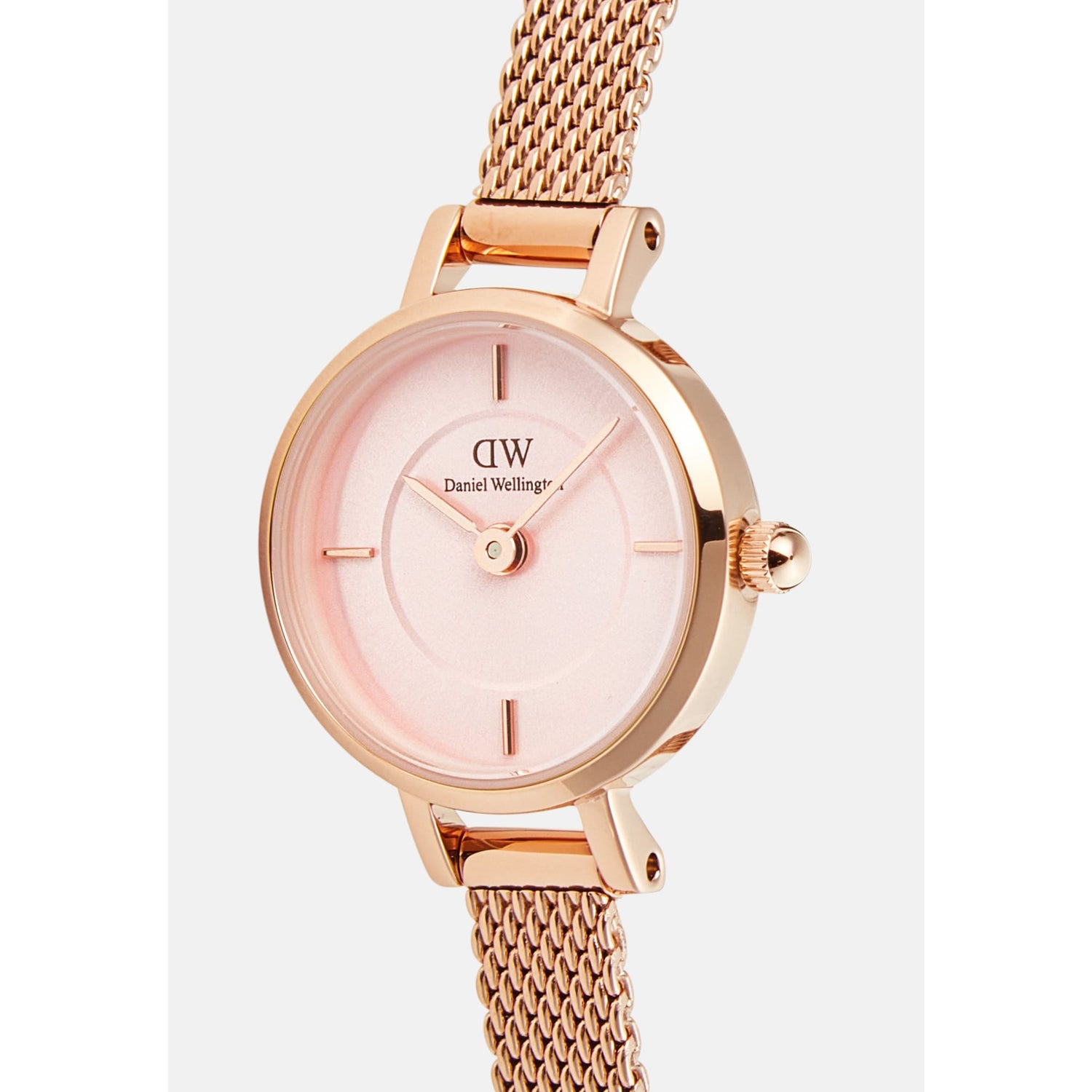 Close-up of the Petite Mini Blush Melrose watch showing its blush pink sunray dial, delicate inner ring, and rose gold mesh strap, highlighting the elegant and refined details.