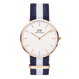 Classic Glasgow Rose Gold watch with a round rose gold case, minimalist white dial, and a blue and white striped polyester NATO strap, blending timeless elegance with a nautical-inspired design.