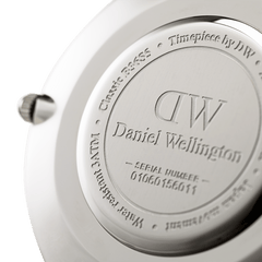 Engraved stainless steel case back of the Classic Southampton Silver watch, featuring Daniel Wellington branding, water resistance details, and a unique serial number for authenticity.