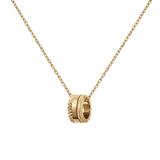 Gold necklace with a geometric-inspired ring pendant featuring textured details and a polished finish, suspended from a delicate adjustable chain. The necklace has a modern, minimalist design that highlights its refined gold tone and subtle sophistication.