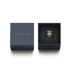 Elan Triad Ring Silver with a triple band design, presented in an elegant dark gift box with the Daniel Wellington logo, ideal for gifting or special occasions.
