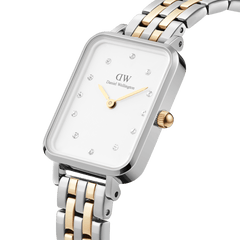 Quadro Lumine 5-link two-tone ladies watch featuring a rectangular eggshell white dial with crystal hour markers, gold hands, and a silver and gold stainless steel bracelet.