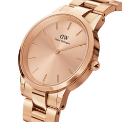 Close-up of the Iconic Link Unitone RG rose gold ladies watch, showing the seamless rose gold dial, minimalist hour markers, and polished rose gold link bracelet for a refined, modern finish.