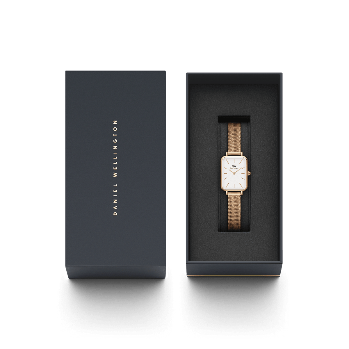 Quadro Pressed Melrose Rose Gold ladies watch with a rectangular case and rose gold mesh strap presented in a sleek black Daniel Wellington gift box.