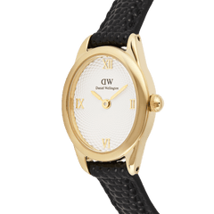 Close-up of the Daniel Wellington Ophelia Mini Black Lizard White Guilloché Gold watch, featuring a gold oval case, textured white guilloché dial with gold Roman numerals, and a black lizard grain leather strap.