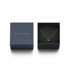 Classic Lumine Unity Gold necklace with interlocking rings presented in a navy Daniel Wellington gift box, highlighting its elegant packaging for gifting.