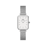 Quadro Pressed Sterling features a petite rectangular stainless steel case, eggshell white dial, and a refined silver mesh strap, offering a minimalist and elegant watch design for women.