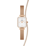 Rose gold ladies watch with a rectangular face, crystal-set bezel, and mesh strap, paired with a classic tennis bracelet featuring sparkling stones for a coordinated, elegant look.