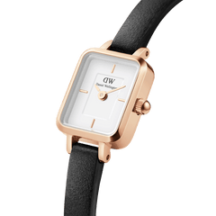 Close-up of the Quadro Mini Sheffield Rose Gold watch featuring a rectangular rose gold case, minimalist white dial, and slim black leather strap, highlighting its refined and timeless design for women.