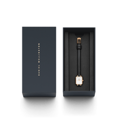 Quadro Mini Sheffield Rose Gold ladies watch presented in a sleek Daniel Wellington gift box, featuring a petite rectangular rose gold case, minimalist white dial, and slim black leather strap.