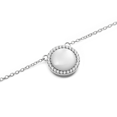 Close-up of the Audrey Necklace Mother of Pearl Silver, showing a domed mother of pearl pendant surrounded by a halo of sparkling white cubic zirconia crystals on a polished silver chain.
