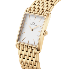 Bound 9-Link Gold watch with a rectangular 18k gold plated case, minimalist white dial, and integrated 9-link gold bracelet, shown in a close-up angled view highlighting its polished finish and geometric design.