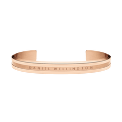 Minimalist Elan Bracelet Rose Gold by Daniel Wellington, featuring a warm rose gold tone, engraved logo, and open cuff style suitable for both men and women.