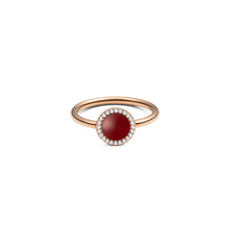 Rose gold ring featuring a domed red agate stone at the centre, encircled by a halo of white cubic zirconia crystals on a slim, polished band.