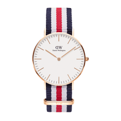 Classic Canterbury Rose Gold watch featuring a slim rose gold case, minimalist eggshell white dial, and a blue, white, and red striped NATO strap, designed for both men and women.