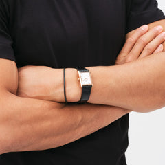 Bound Black Crocodile Rose Gold watch worn on the wrist, featuring a rectangular rose gold case and crocodile-embossed black leather strap, styled with a black t-shirt for a versatile, modern look.