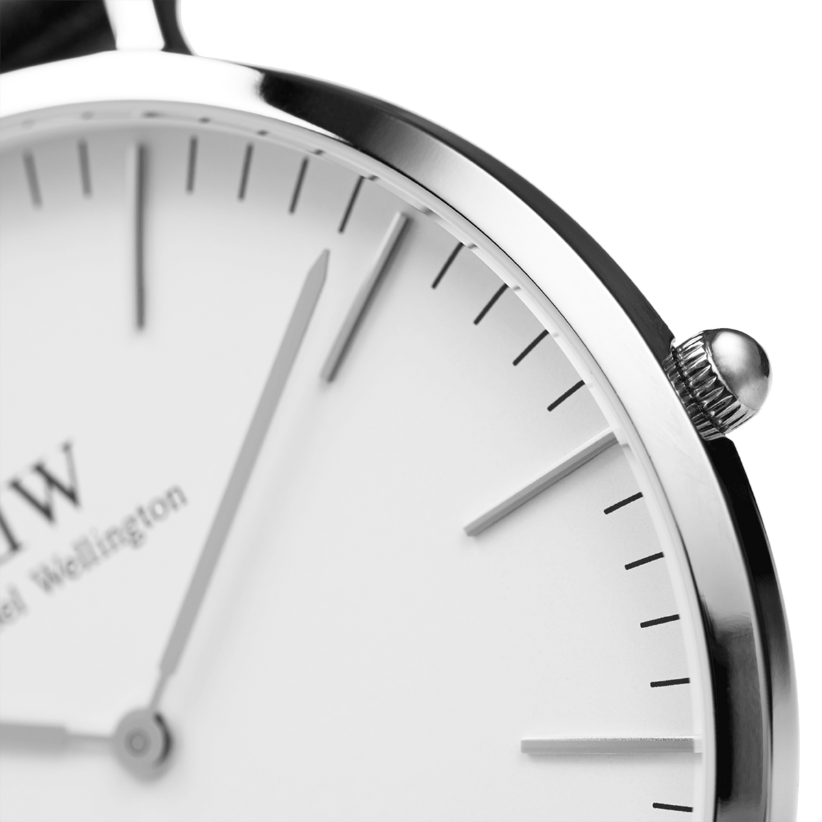Close-up of the Classic St Mawes Silver watch highlighting the polished silver case, minimalist eggshell white dial, and slim hands, showcasing refined detailing and quality craftsmanship.